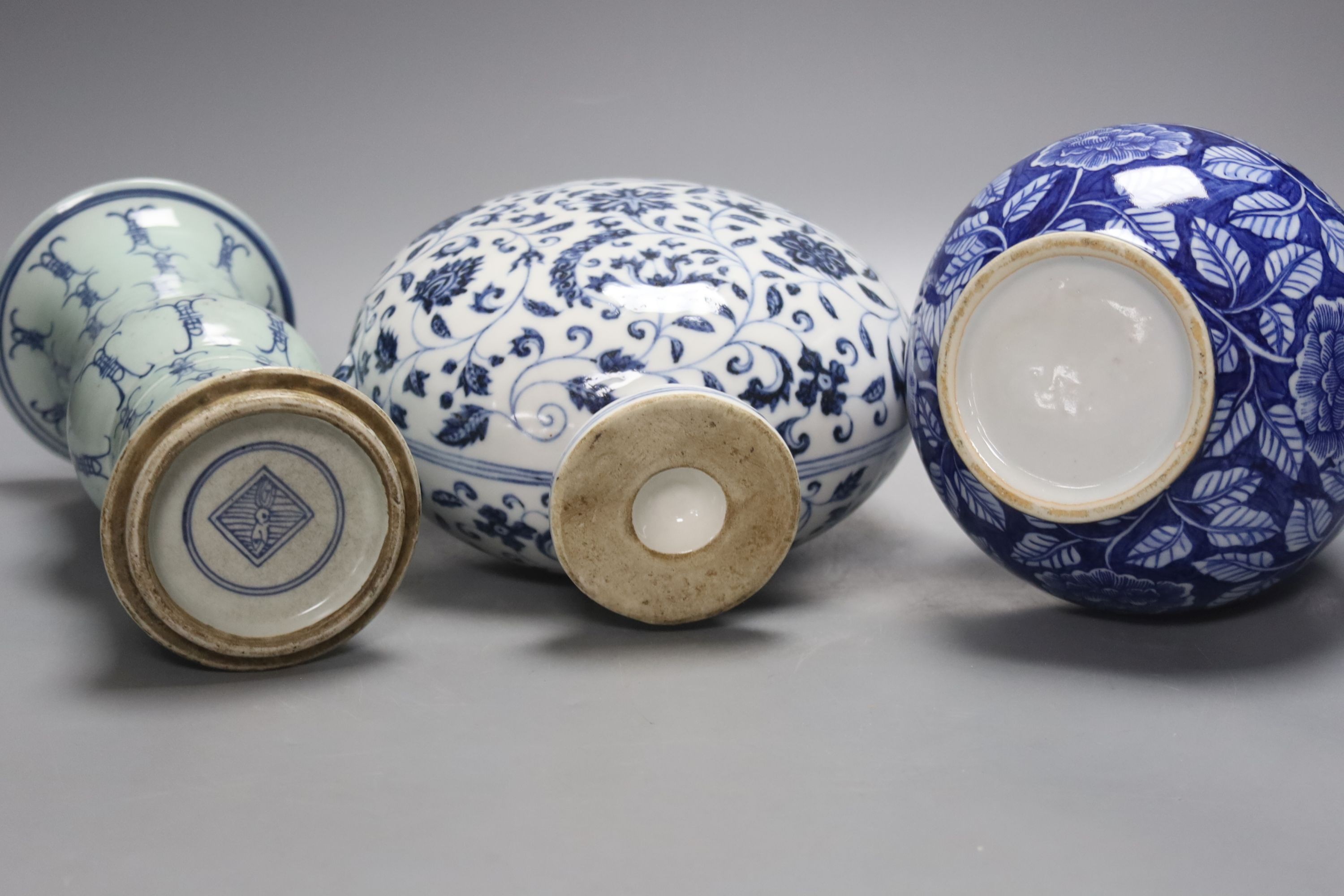 Two Chinese blue and white vases and a similar moon flask, moon flask 28 cms high.